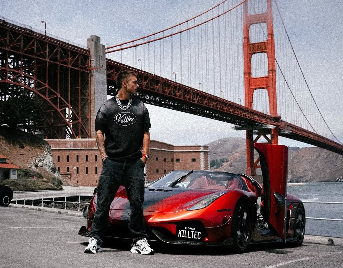 Lines identity — self-made member with a hypercar at the Golden Gate Bridge