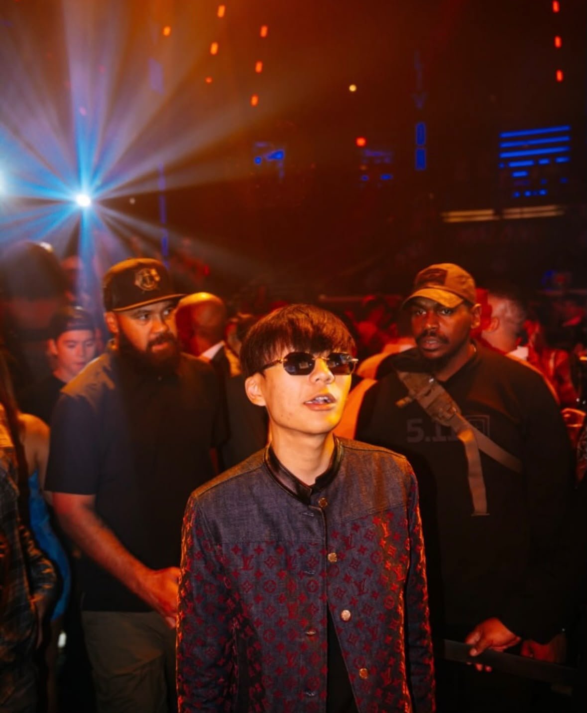 VIP guest escorted by a close-protection security detail